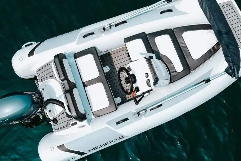 Slide: The Image of Manufacturer Provided Image: 2025 Highfield Sport 330 boat, aerial view, sleek design on blue water. - 4