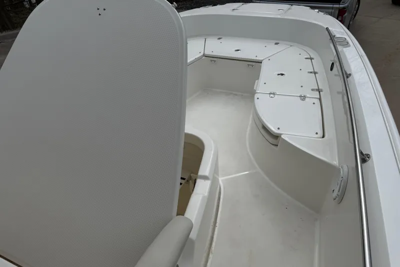 Slide: The Image of 2022 Boston Whaler 270 Dauntless boat interior with seating and storage compartments. - 10