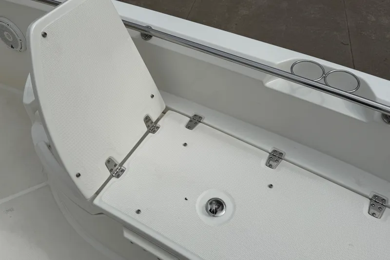Slide: The Image of 2022 Boston Whaler 270 Dauntless boat seat with cup holders and stainless steel fittings. - 11
