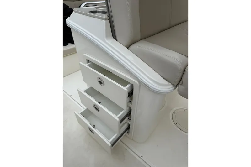 Slide: The Image of Storage drawers on a 2022 Boston Whaler 270 Dauntless boat interior. - 18