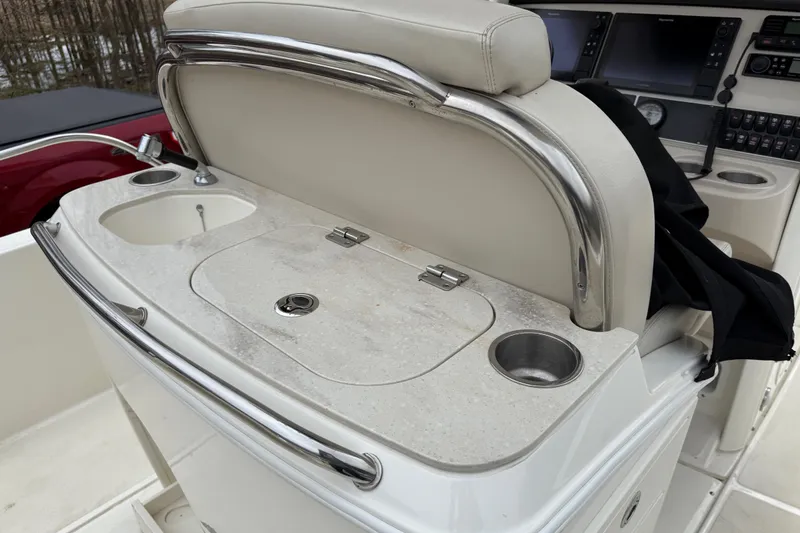 Slide: The Image of Boston Whaler 270 Dauntless 2022 boat console with sink and cup holders. - 20