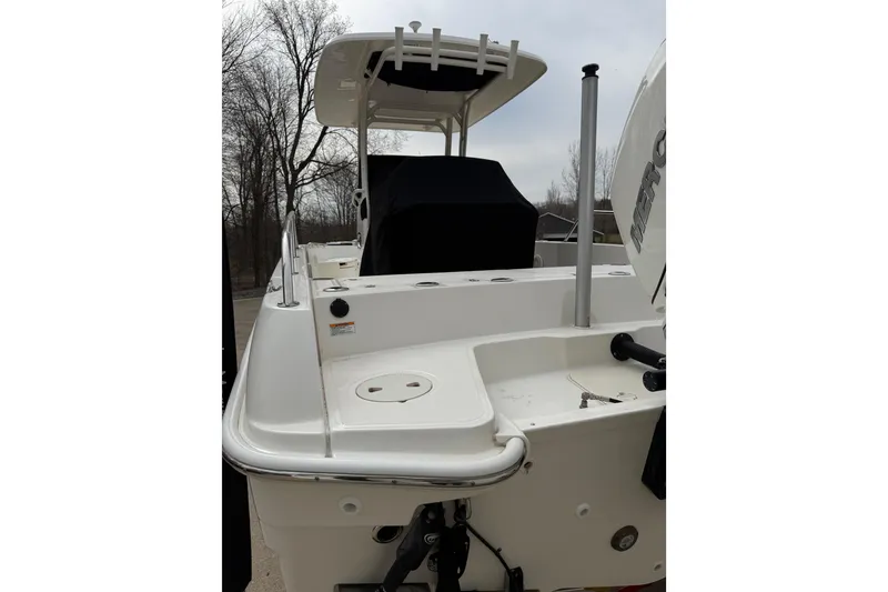 Slide: The Image of 2022 Boston Whaler 270 Dauntless boat, rear view with outboard motor and seating area. - 4