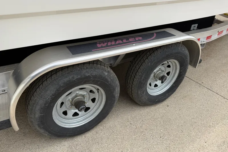 Slide: The Image of Trailer wheels of a 2022 Boston Whaler 270 Dauntless boat. - 8