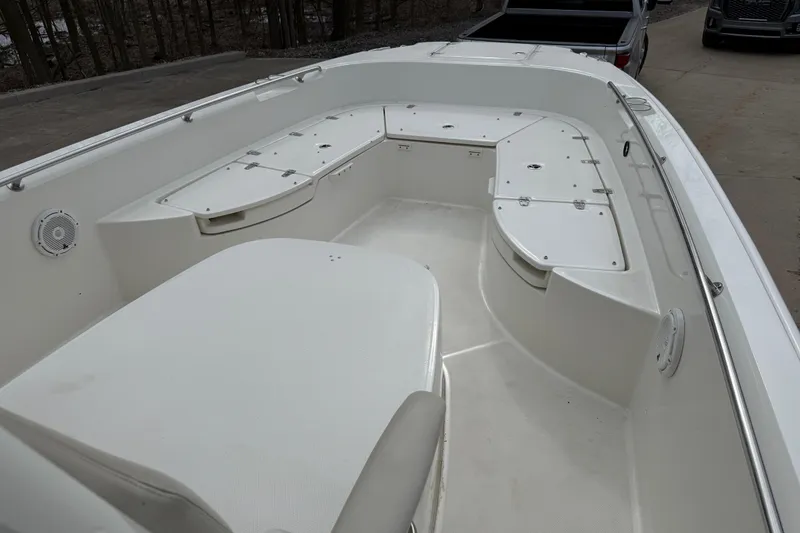 Slide: The Image of 2022 Boston Whaler 270 Dauntless boat interior with seating and storage compartments. - 9