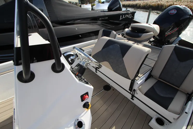 Slide: The Image of 2023 Vexus AVX2180CC boat interior with steering console and seating. - 12