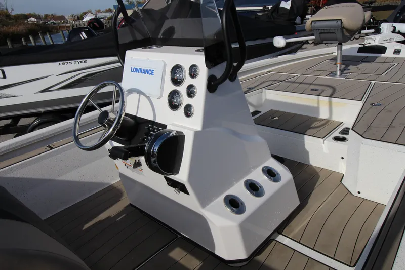 Slide: The Image of 2023 Vexus AVX2180CC boat console with steering wheel and Lowrance electronics. - 6