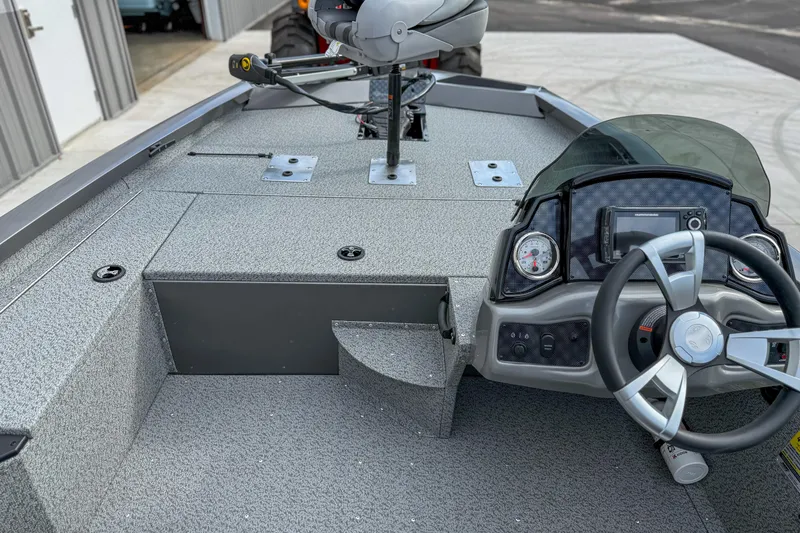 Slide: The Image of 2026 G3 Sportsman 1610 boat interior with steering wheel and dashboard controls. - 10