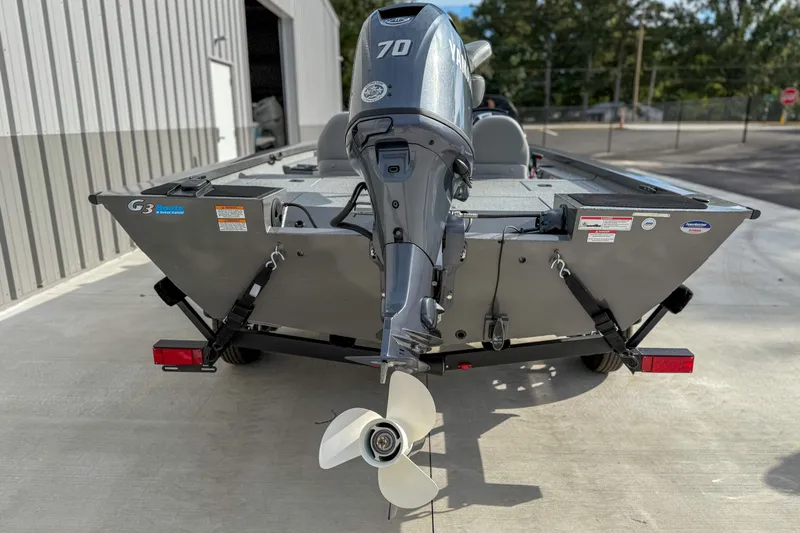 Slide: The Image of 2026 G3 Sportsman 1610 boat with Yamaha 70 engine, parked outside a building. - 4