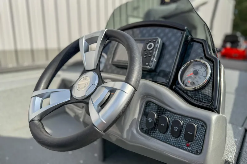 Slide: The Image of Steering console of 2026 G3 Sportsman 1610 boat with gauges and controls. - 6