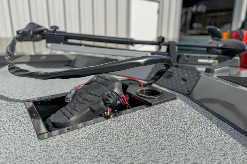 Slide: The Image of 2026 G3 Sportsman 1610 boat deck with trolling motor and pedal controls. - 8