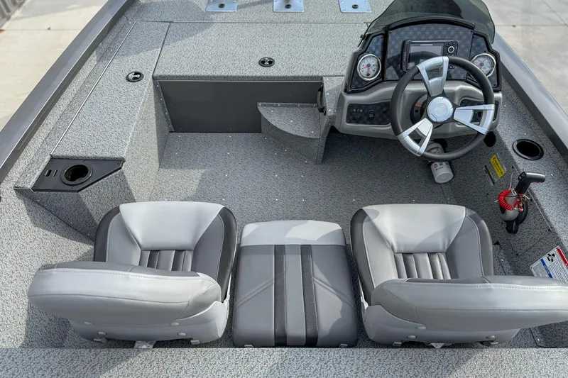 Slide: The Image of 2026 G3 Sportsman 1610 boat interior with steering wheel and seating. - 9