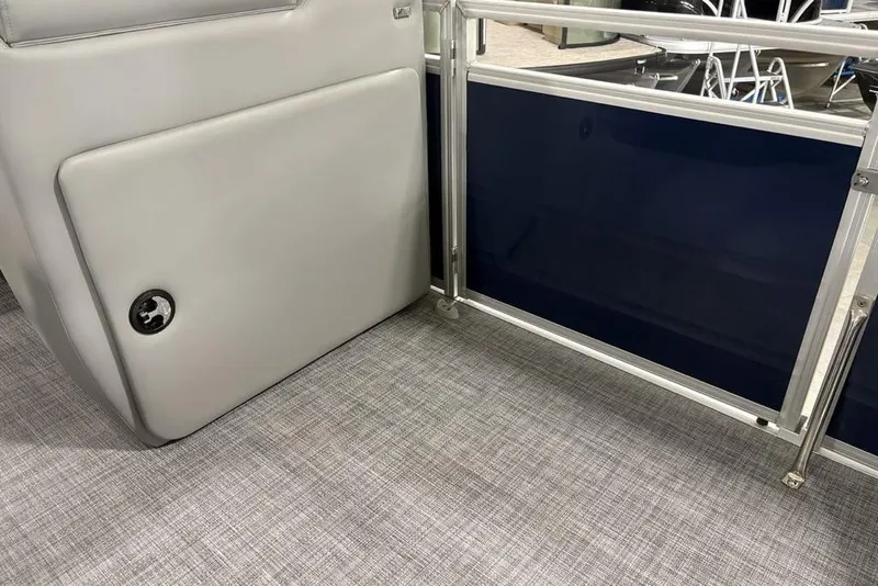 Slide: The Image of Interior view of 2026 Sun Tracker SportFish 20 DLX pontoon boat, featuring sleek seating and flooring. - 16