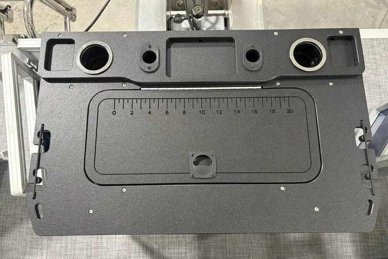 Slide: The Image of Control panel of 2026 Sun Tracker SportFish 20 DLX with cup holders and ruler. - 31