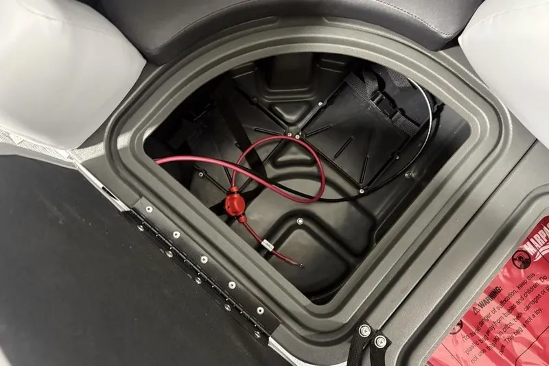 Slide: The Image of Storage compartment of 2026 Sun Tracker SportFish 20 DLX boat with red wiring. - 6