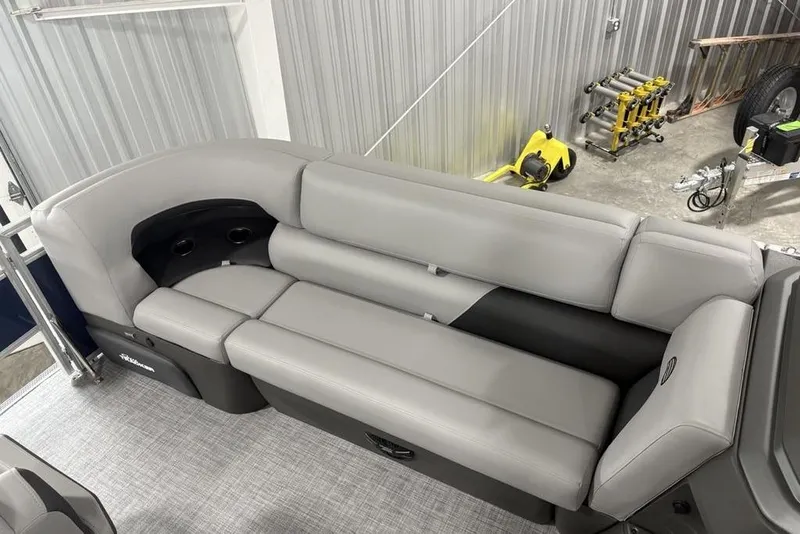 Slide: The Image of 2026 Sun Tracker SportFish 20 DLX boat interior with gray seating and cup holders. - 9