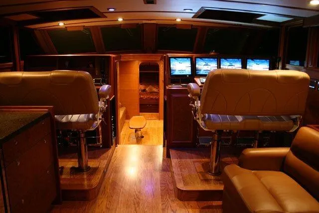 Slide: The Image of Luxurious interior of 2009 Saint Custom Boats Model 65 Commuter with leather seating and control panels. - 4
