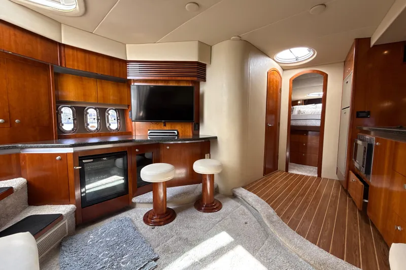 Slide: The Image of Luxurious interior of 2006 Cruisers Yachts 420 Express with wood finishes and modern amenities. - 23