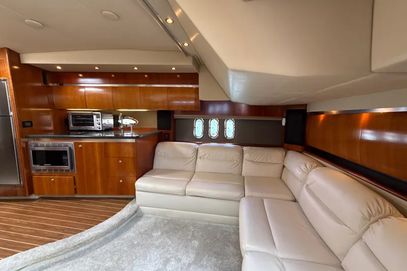 Slide: The Image of Luxurious interior of 2006 Cruisers Yachts 420 Express with leather seating and modern kitchen. - 25