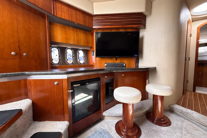 Slide: The Image of Luxurious interior of 2006 Cruisers Yachts 420 Express with wood cabinetry and seating. - 30