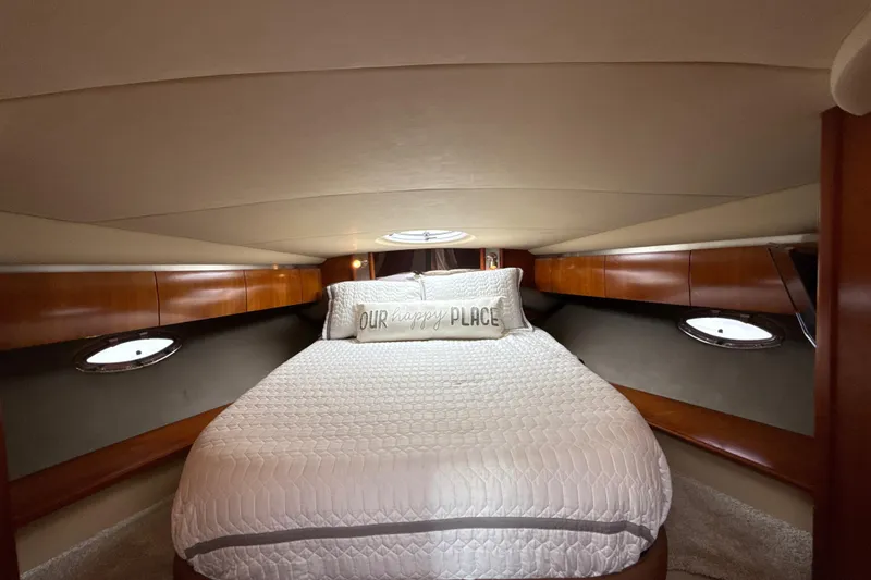Slide: The Image of Luxurious cabin interior of 2006 Cruisers Yachts 420 Express with cozy bedding. - 31