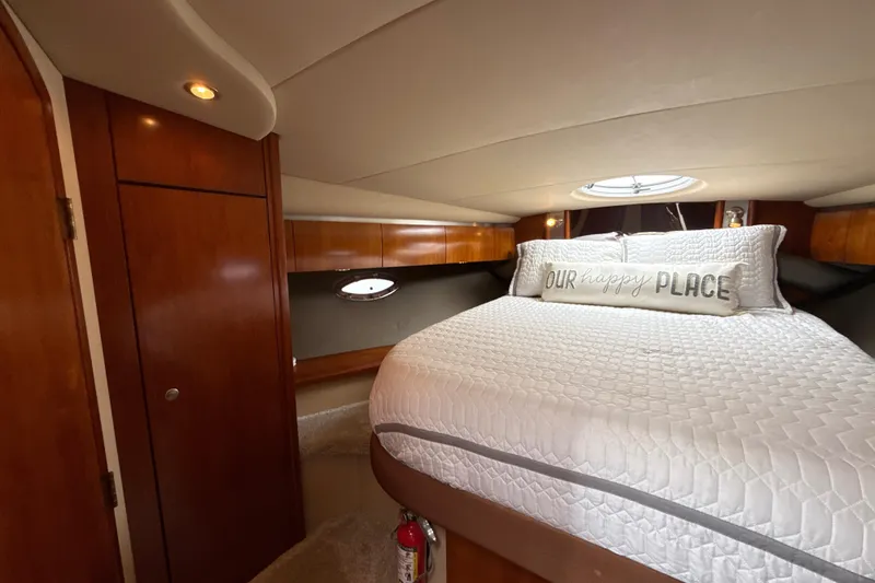 Slide: The Image of Luxurious cabin interior of 2006 Cruisers Yachts 420 Express with cozy bedding. - 32