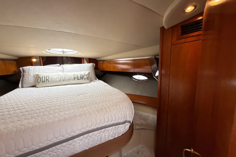 Slide: The Image of Luxurious cabin interior of 2006 Cruisers Yachts 420 Express with cozy bedding. - 33