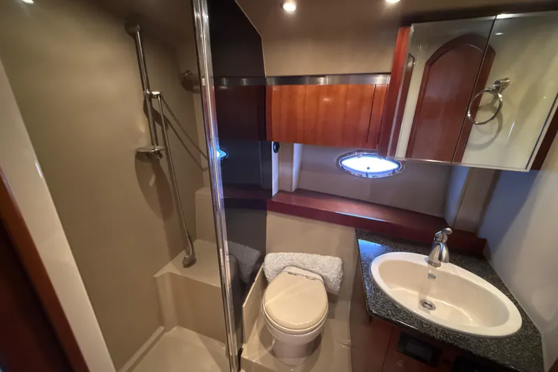 Slide: The Image of Luxurious bathroom in 2006 Cruisers Yachts 420 Express with shower, sink, and toilet. - 34