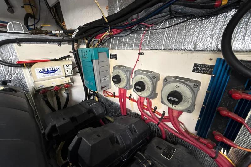 Slide: The Image of Engine room of 2006 Cruisers Yachts 420 Express with electrical components and wiring. - 35