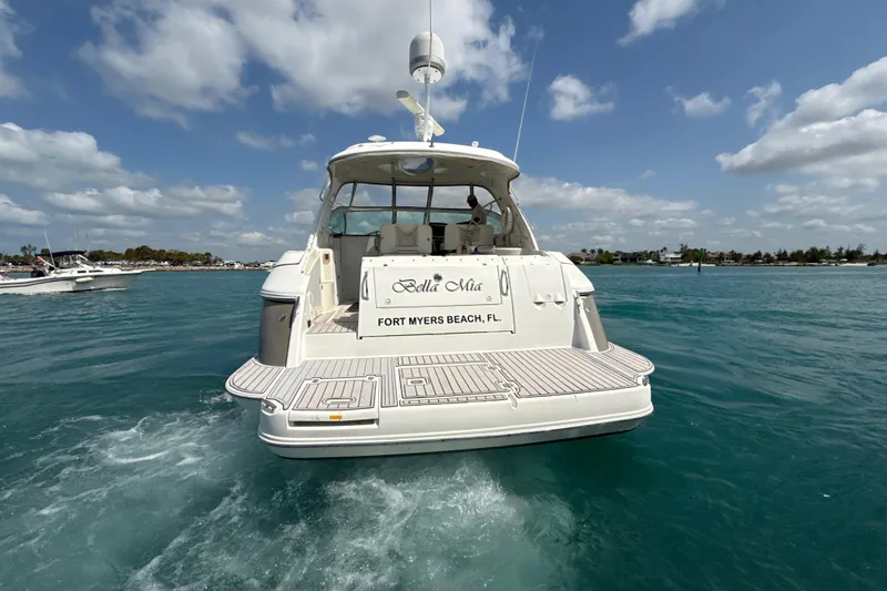 Slide: The Image of 2006 Cruisers Yachts 420 Express on water, Fort Myers Beach, clear sky. - 41