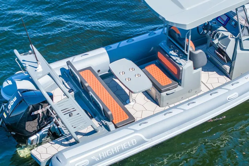 Slide: The Image of Manufacturer Provided Image: Highfield Sport 760 boat, 2025 model, with seating and table on water. - 4