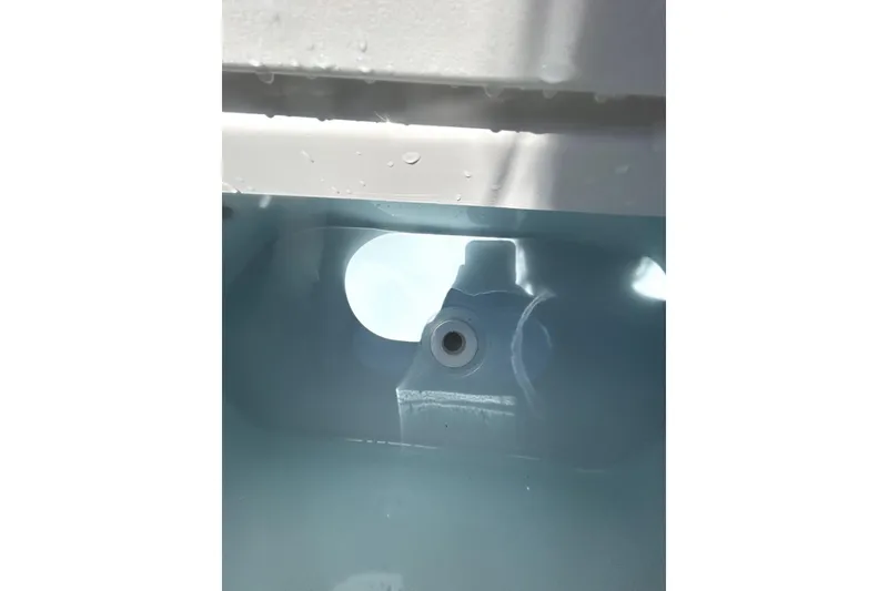 Slide: The Image of Interior view of a 2023 Key West 239 FS boat compartment with water droplets. - 21