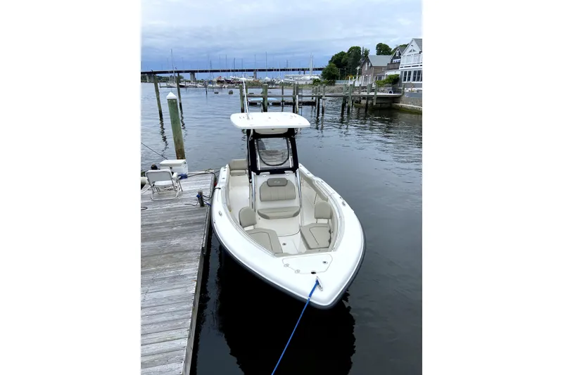 Slide: The Image of 2023 Key West 239 FS boat docked at a marina with calm waters. - 25
