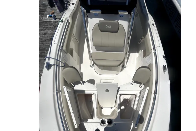 Slide: The Image of 2023 Key West 239 FS boat interior with seating and storage compartments. - 7