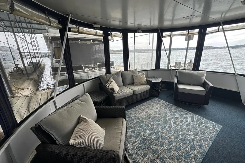 Slide: The Image of Cozy seating area on 1996 Lazy Days 15x64 houseboat with lake view. - 2