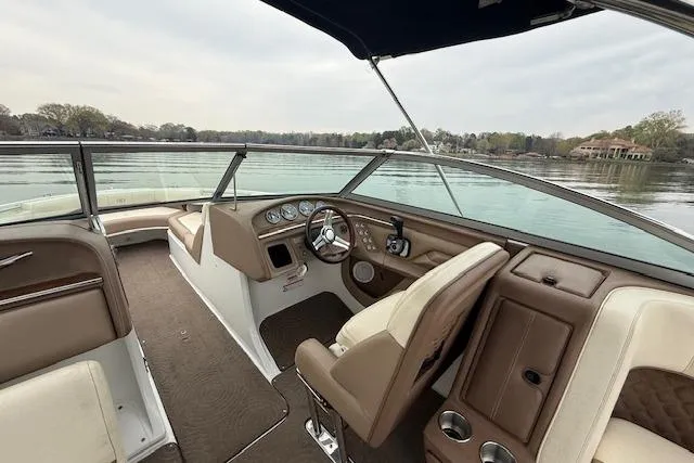 Slide: The Image of Interior of a 2010 Cobalt 276 boat with brown and beige seating. - 15
