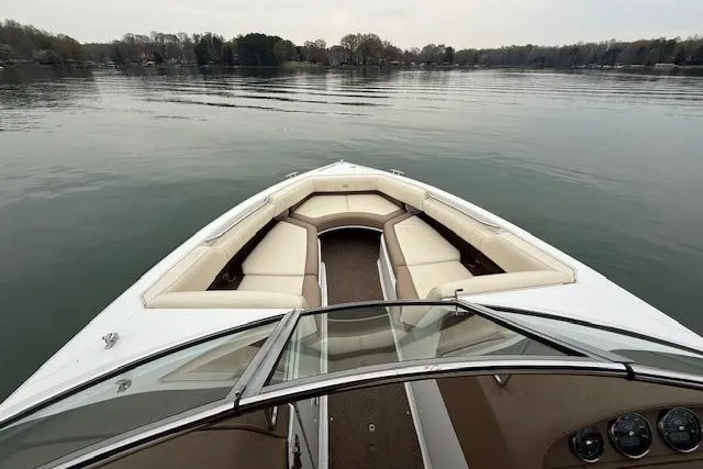 Slide: The Image of 2010 Cobalt 276 boat with spacious seating on a calm lake. - 17