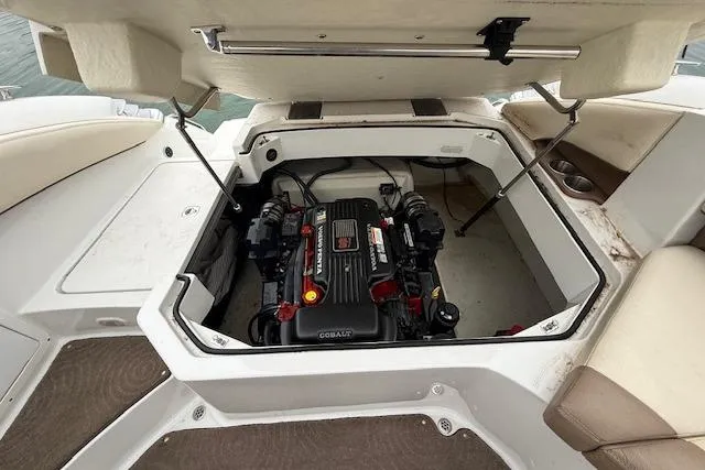 Slide: The Image of Open engine compartment of 2010 Cobalt 276 boat showing engine details. - 21