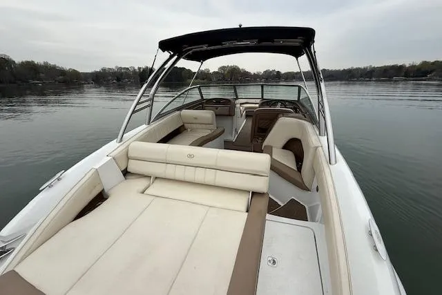 Slide: The Image of 2010 Cobalt 276 boat with spacious seating on a calm lake. - 9