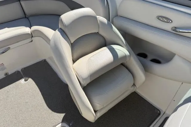Slide: The Image of 2006 Chaparral 220 SSi boat interior with gray seating and cup holders. - 10