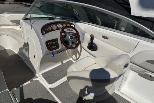 Slide: The Image of 2006 Chaparral 220 SSi boat interior with steering wheel and dashboard controls. - 15