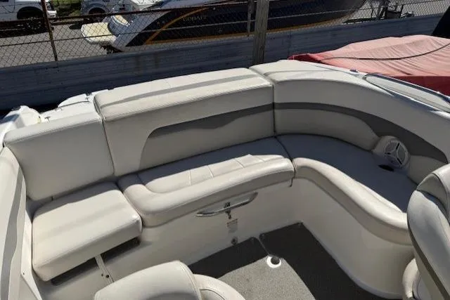 Slide: The Image of 2006 Chaparral 220 SSi boat interior with white cushioned seating. - 16