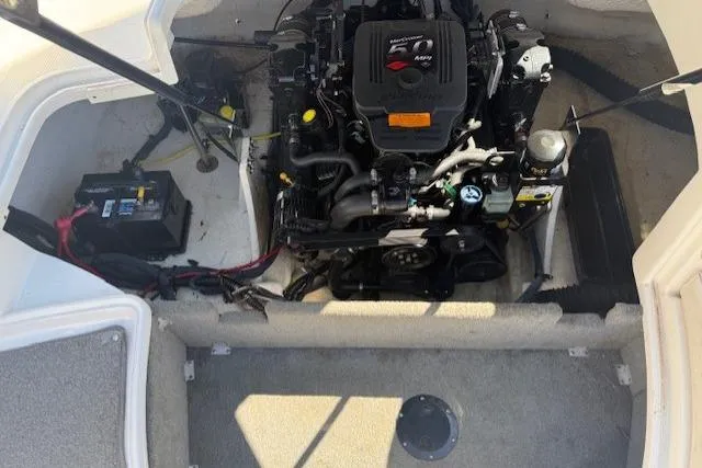 Slide: The Image of Engine compartment of a 2006 Chaparral 220 SSi boat, showing detailed components. - 18