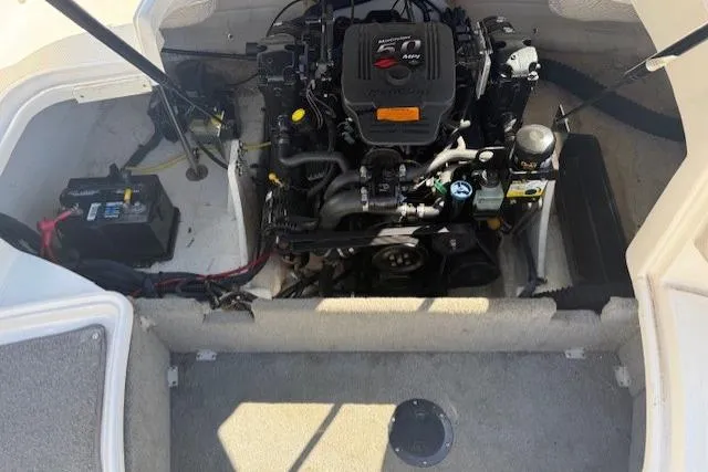 Slide: The Image of Engine compartment of a 2006 Chaparral 220 SSi boat, featuring a 5.0 MerCruiser engine. - 19