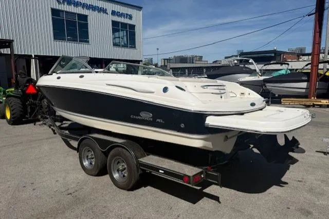 Slide: The Image of 2006 Chaparral 220 SSi boat on trailer at marina, sunny day. - 2
