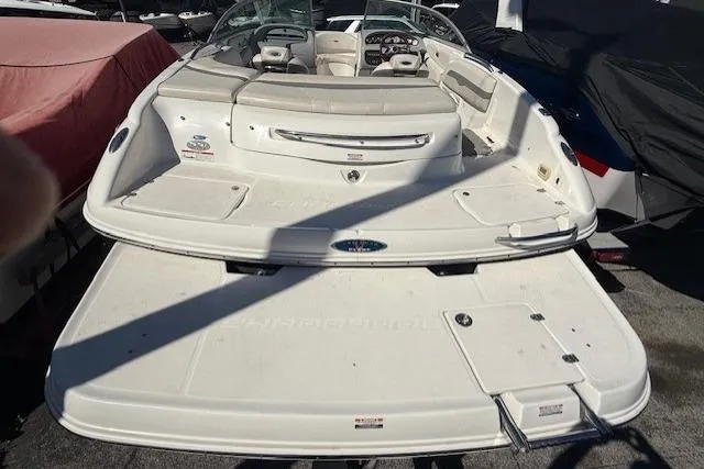 Slide: The Image of 2006 Chaparral 220 SSi boat with spacious deck and seating, viewed from the rear. - 22