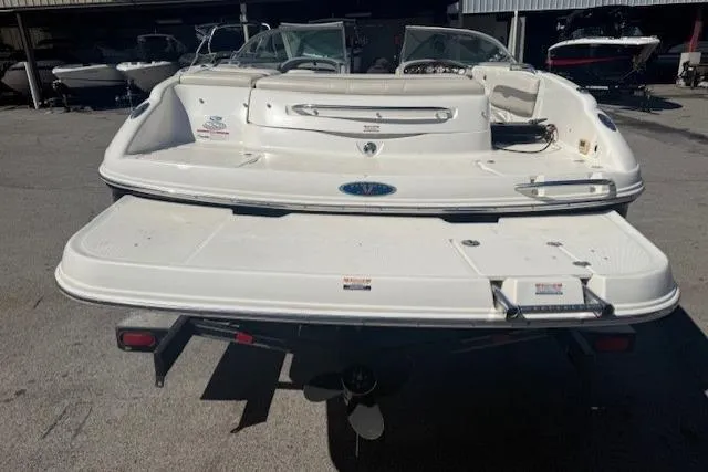 Slide: The Image of 2006 Chaparral 220 SSi boat rear view, showcasing swim platform and propeller. - 23