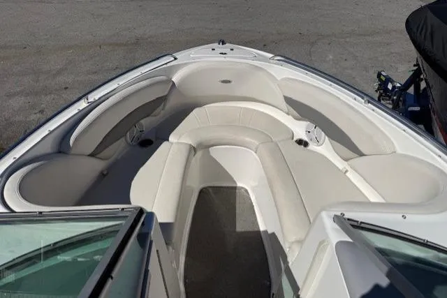 Slide: The Image of 2006 Chaparral 220 SSi boat interior with white seating and open bow design. - 7