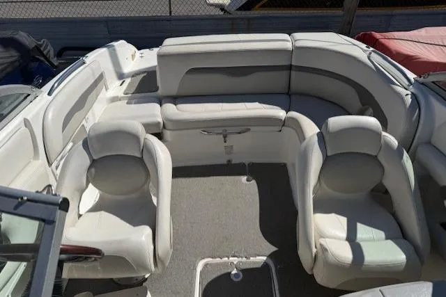 Slide: The Image of 2006 Chaparral 220 SSi boat interior with white seating and carpeted floor. - 8