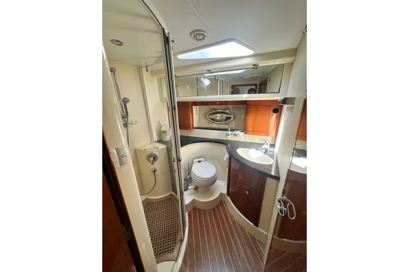 Slide: The Image of Luxurious bathroom in 2002 Fairline 50 yacht with modern fixtures and wood accents. - 11