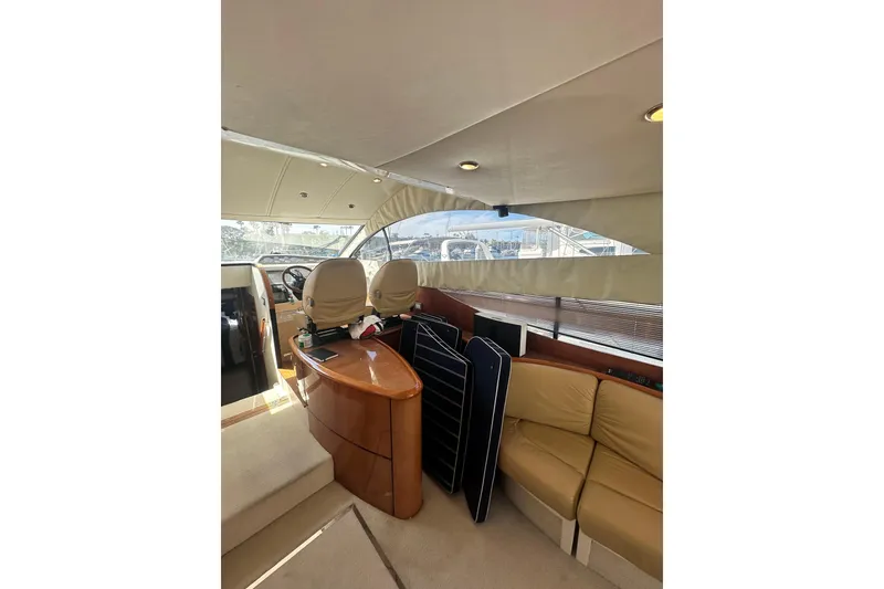Slide: The Image of Interior of 2002 Fairline 50 yacht with beige seating and helm station. - 14